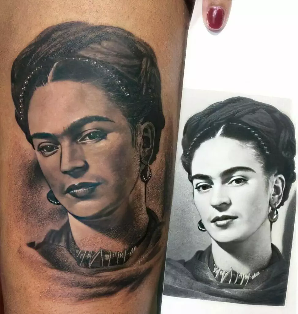 A close-up of a tattoo on a person's arm depicting a woman's face alongside a black and white photograph of the same woman for reference.