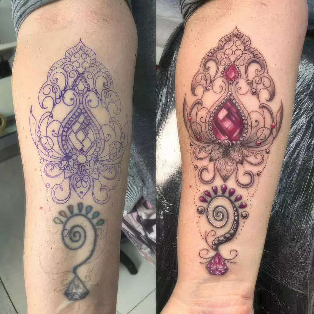 Side-by-side images show a tattoo design in stencil form and the completed tattoo on forearms. The intricate design features ornamental patterns and gem-like elements in vibrant colors.