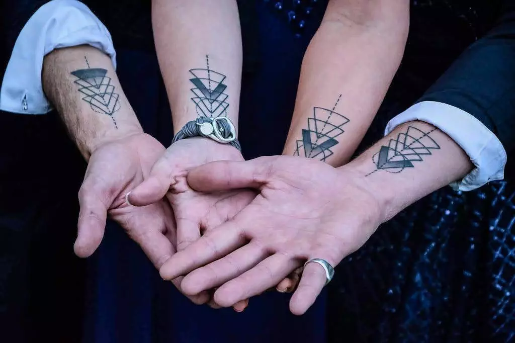 Hands of People with Tattoos